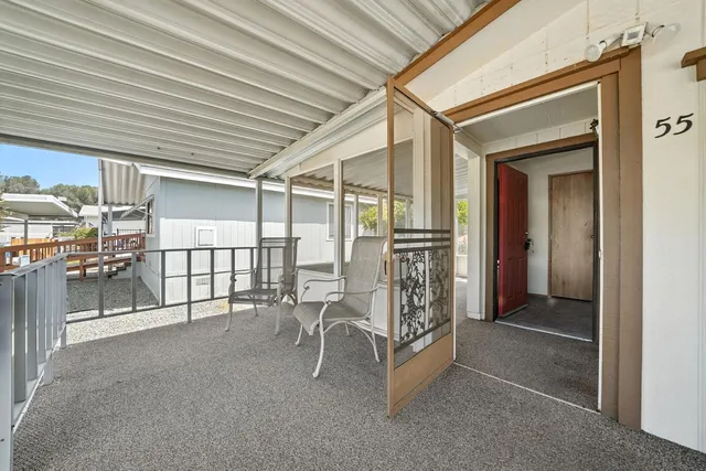 a view of a porch with furniture