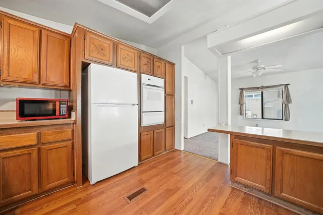 a view of a livingroom with furniture and a flat screen tv