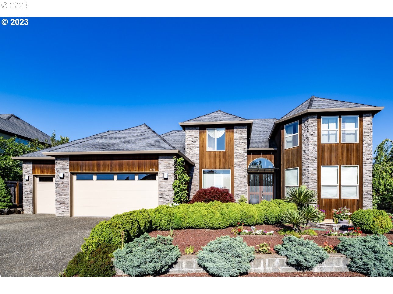 3516 Northeast Ione Street Camas, WA 98607 - Photo 1 of 29 a front view of a house with a yard