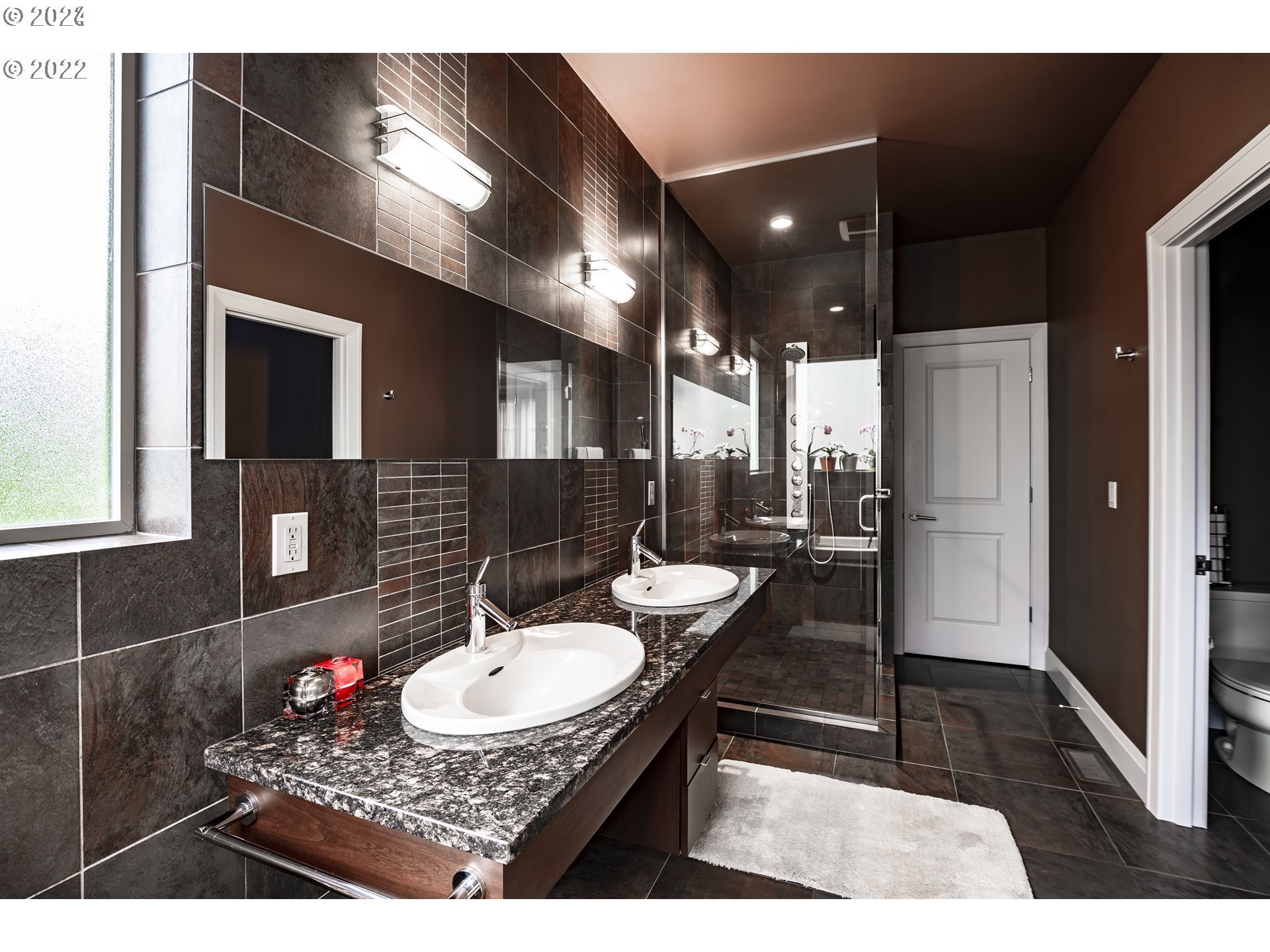 3516 Northeast Ione Street Camas, WA 98607 - Photo 14 of 29 a bathroom with a sink a toilet a mirror and shower