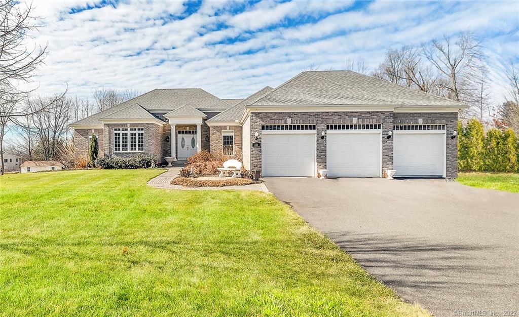 231 Maskel Road South Windsor, CT 06074 - Photo 1 of 1 a front view of house with yard and trees around