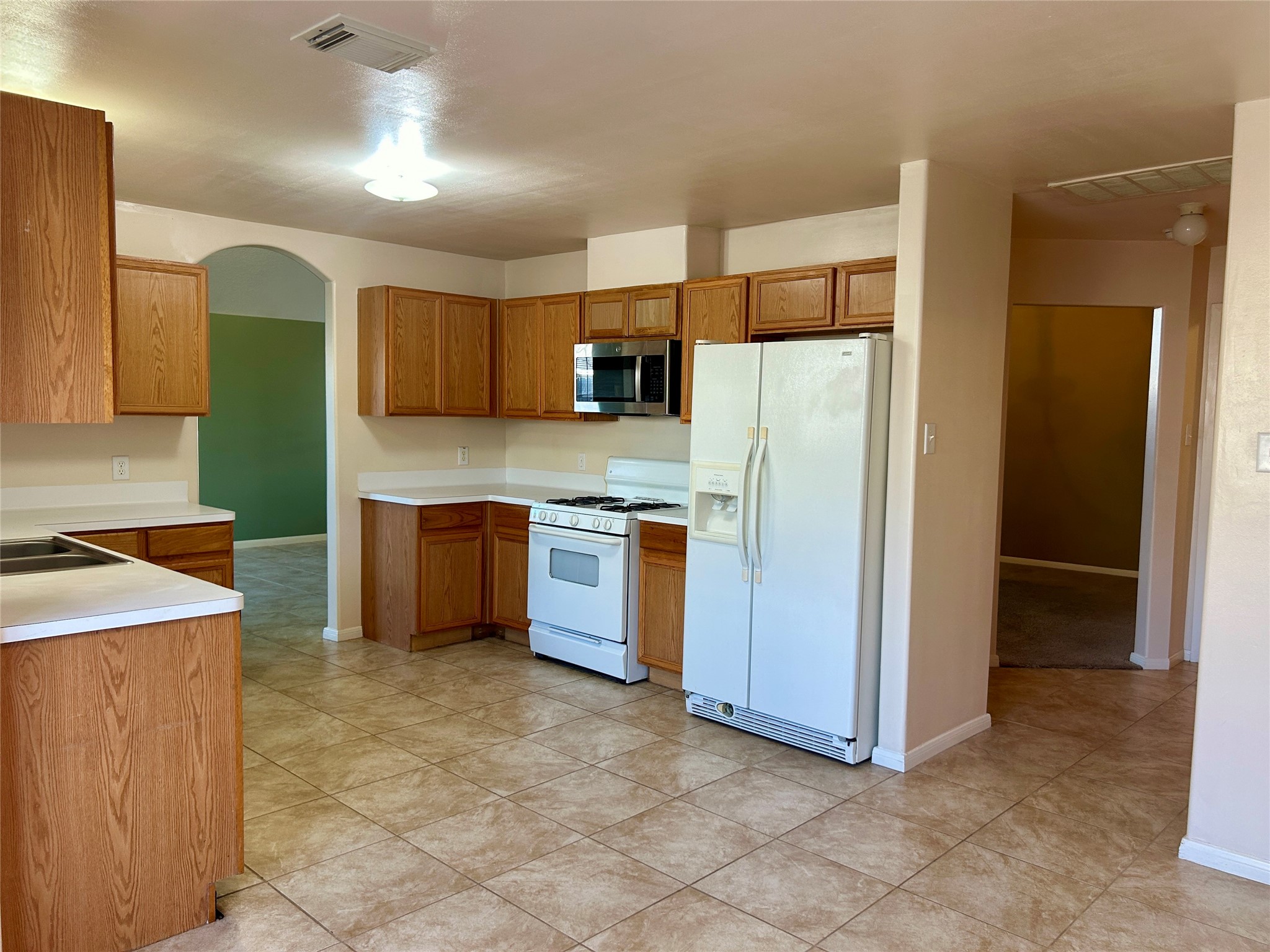 19718 River Pointe Lane Katy, TX 77449 - Photo 12 of 36 a kitchen with stainless steel appliances a refrigerator and a stove