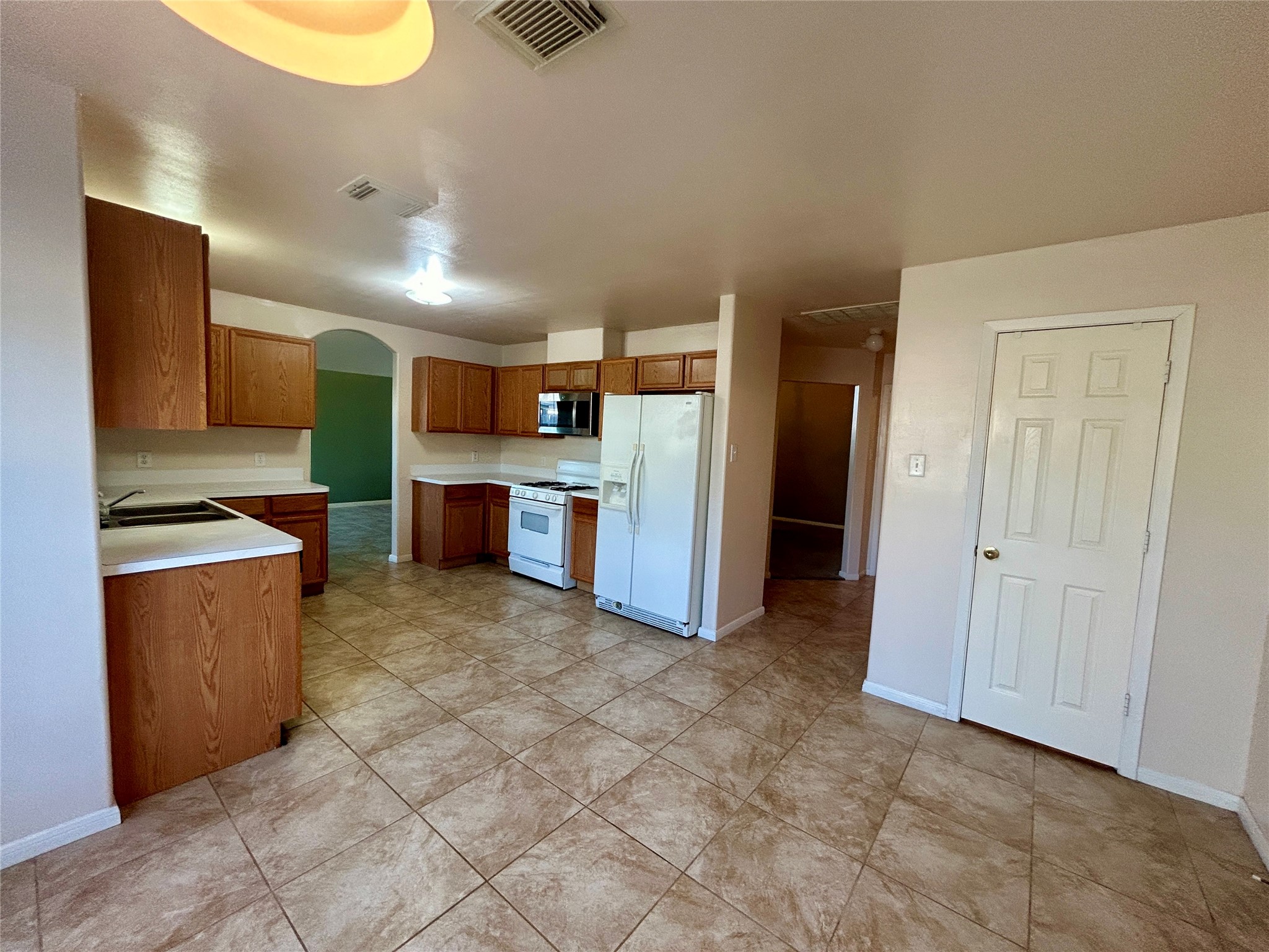 19718 River Pointe Lane Katy, TX 77449 - Photo 14 of 36 a view of a kitchen with a sink