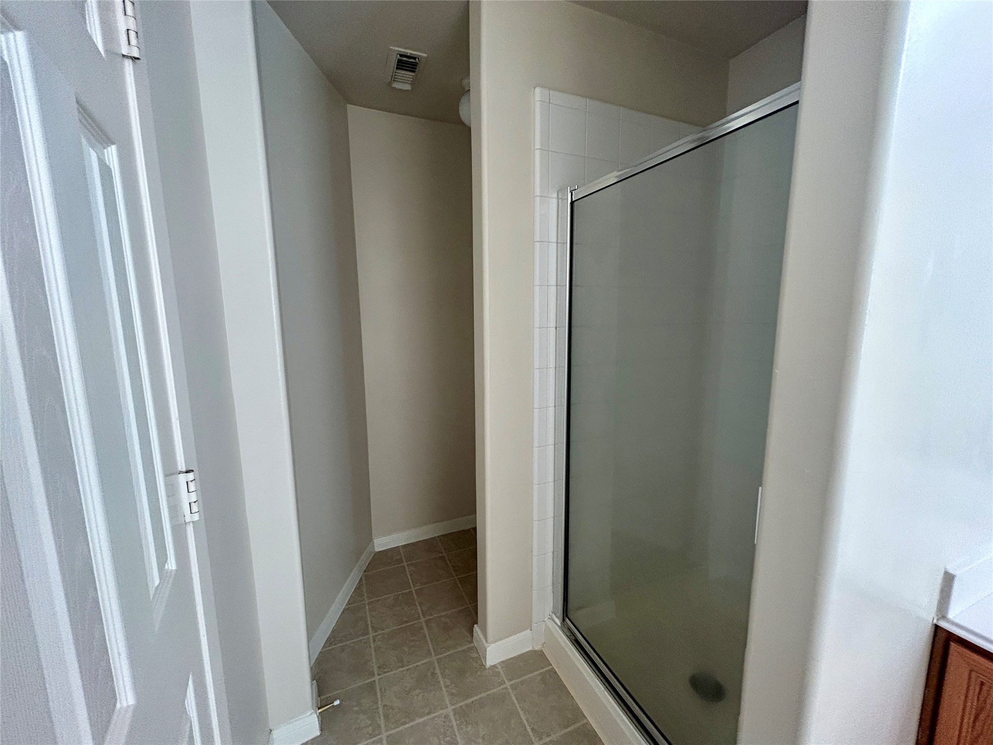 19718 River Pointe Lane Katy, TX 77449 - Photo 25 of 36 a bathroom with a glass door shower