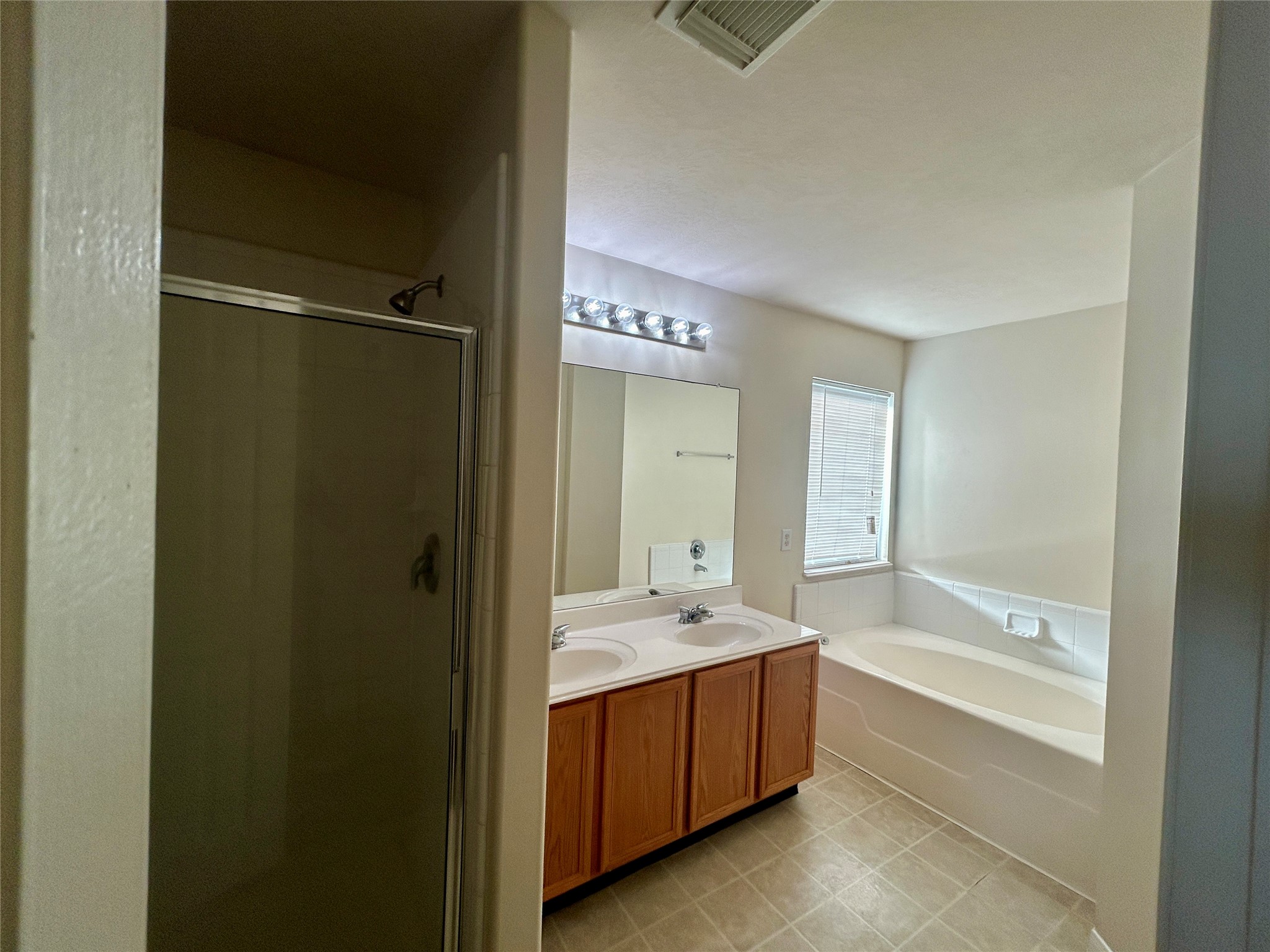 19718 River Pointe Lane Katy, TX 77449 - Photo 26 of 36 a spacious bathroom with a tub shower and sink