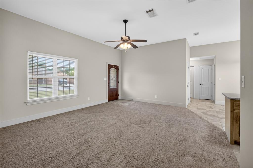 505 East 5th Street Springtown, TX 76082 - Photo 4 of 39 a view of an empty room with a window