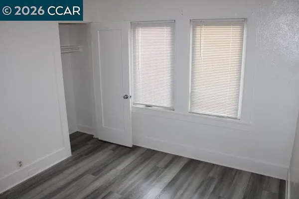 a view of front door with wooden floor