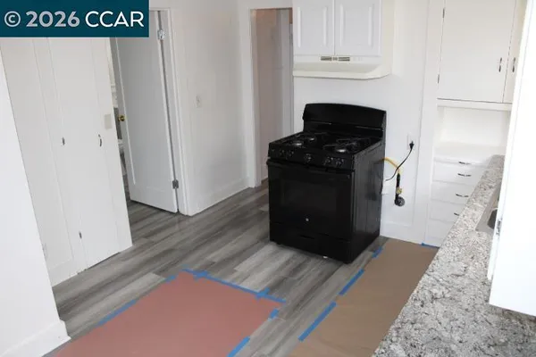 a view of a livingroom with wooden floor