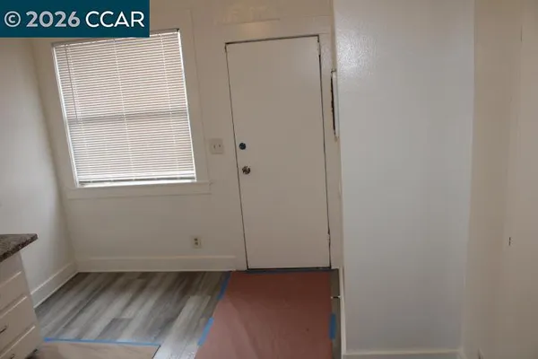 a view of an empty room with a window