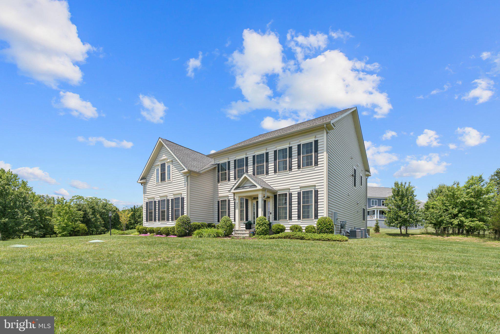 237 Barberry Lane Laytonsville, MD 20882 - Photo 2 of 70 a view of a house with a big yard and large trees