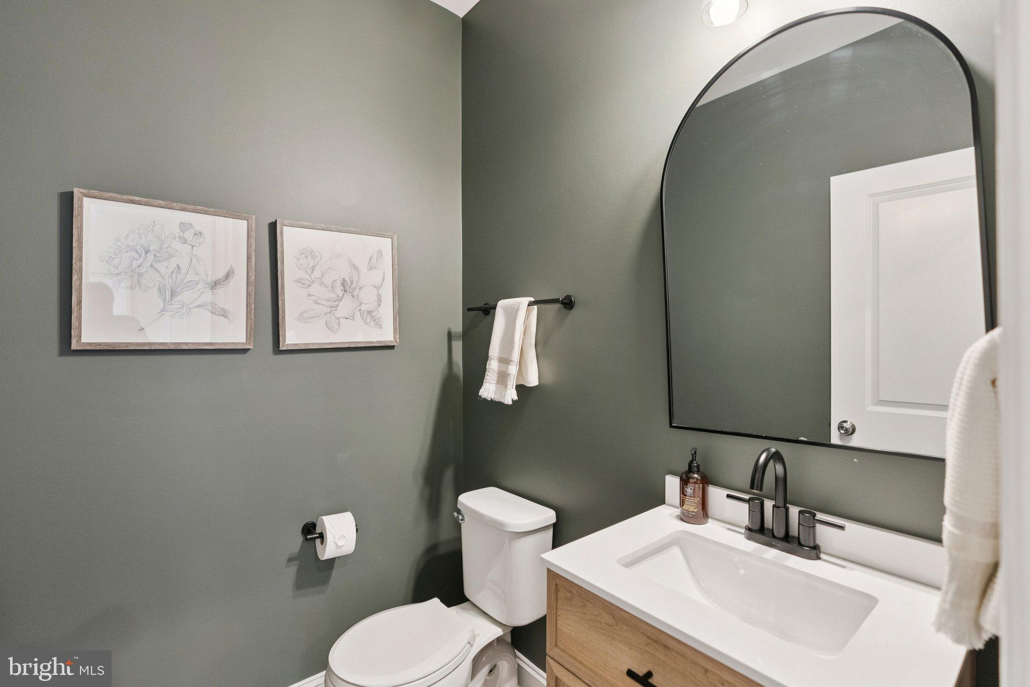 237 Barberry Lane Laytonsville, MD 20882 - Photo 24 of 70 a bathroom with a toilet sink and mirror