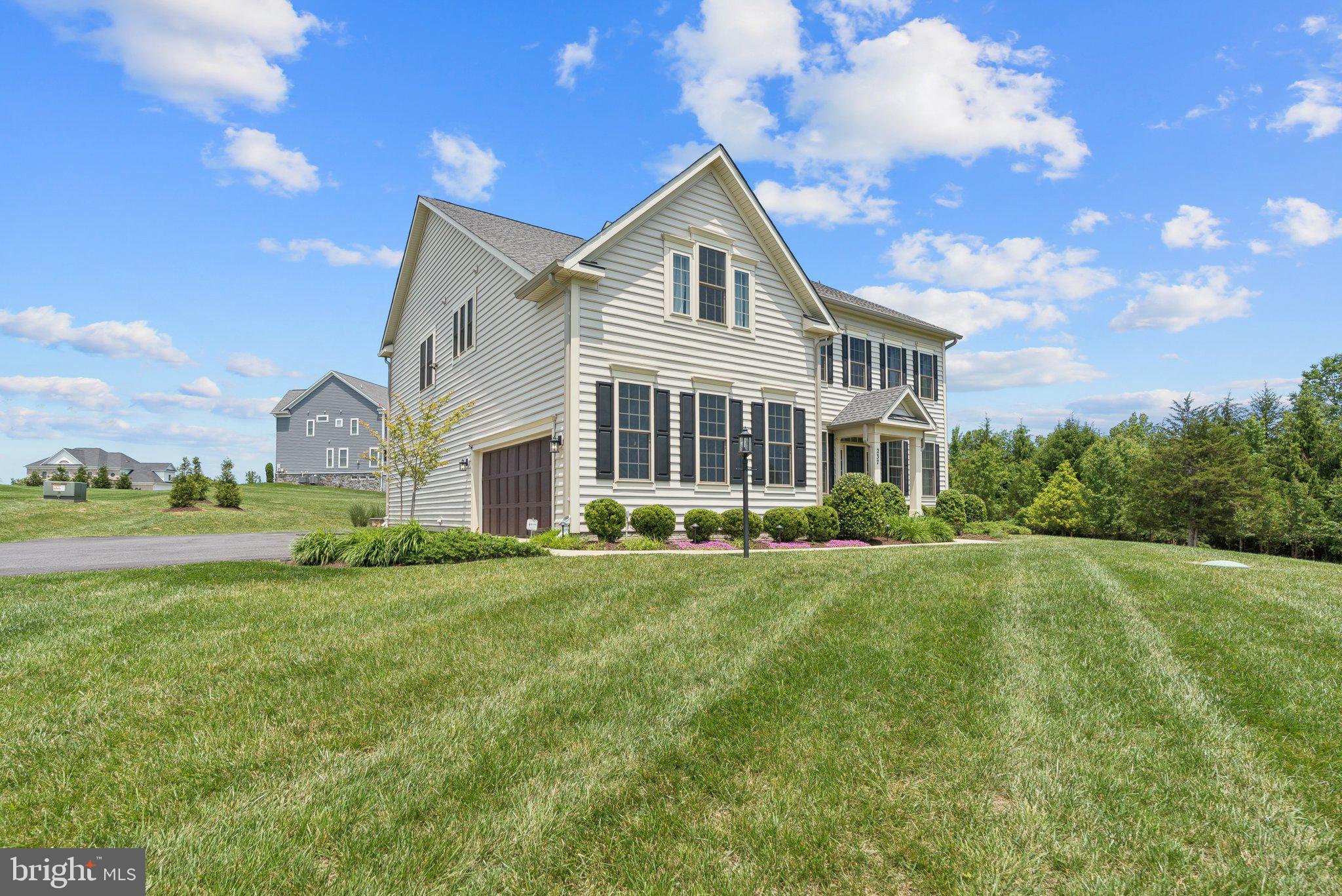 237 Barberry Lane Laytonsville, MD 20882 - Photo 3 of 70 a front view of a house with a yard and garage