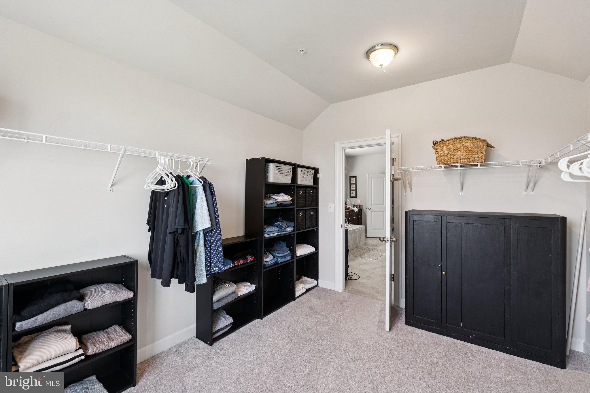 237 Barberry Lane Laytonsville, MD 20882 - Photo 34 of 70 a view of walk in closet with clothes and shoes