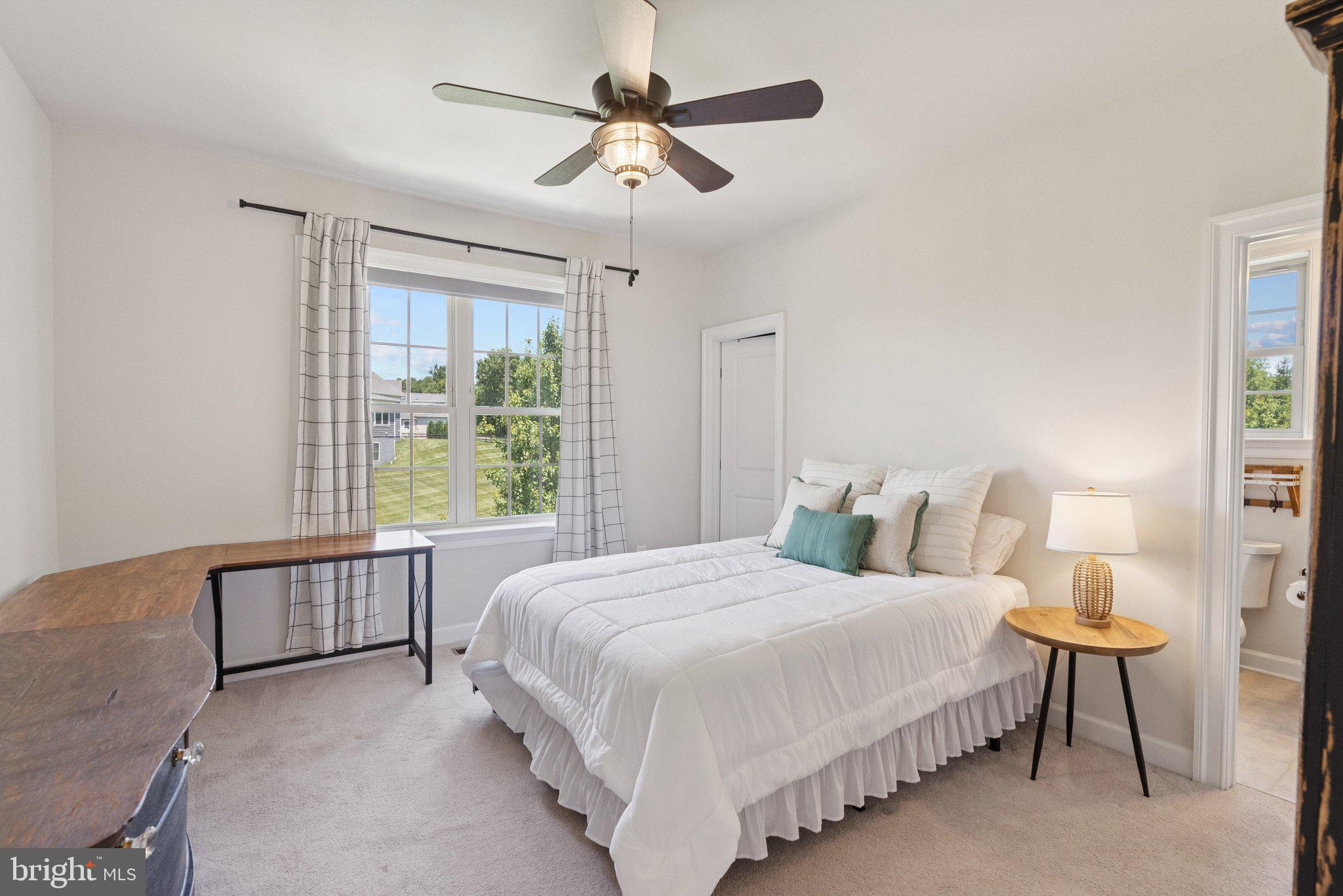 237 Barberry Lane Laytonsville, MD 20882 - Photo 36 of 70 a bedroom with a bed chandelier and a window