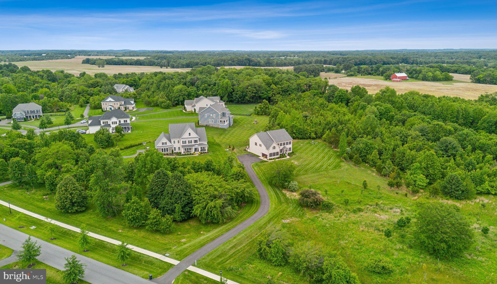 237 Barberry Lane Laytonsville, MD 20882 - Photo 4 of 70 a view of a city with lush green forest