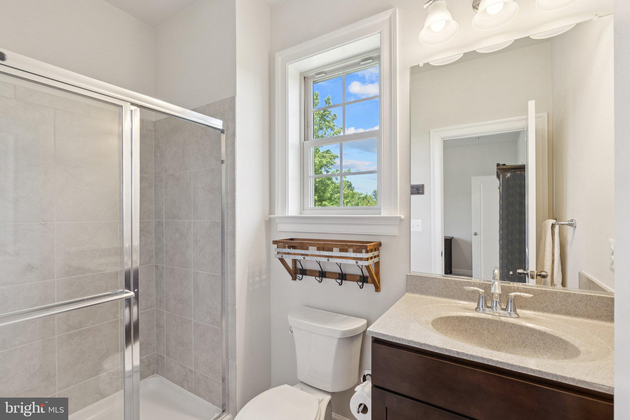 237 Barberry Lane Laytonsville, MD 20882 - Photo 39 of 70 a bathroom with a sink vanity mirror and toilet