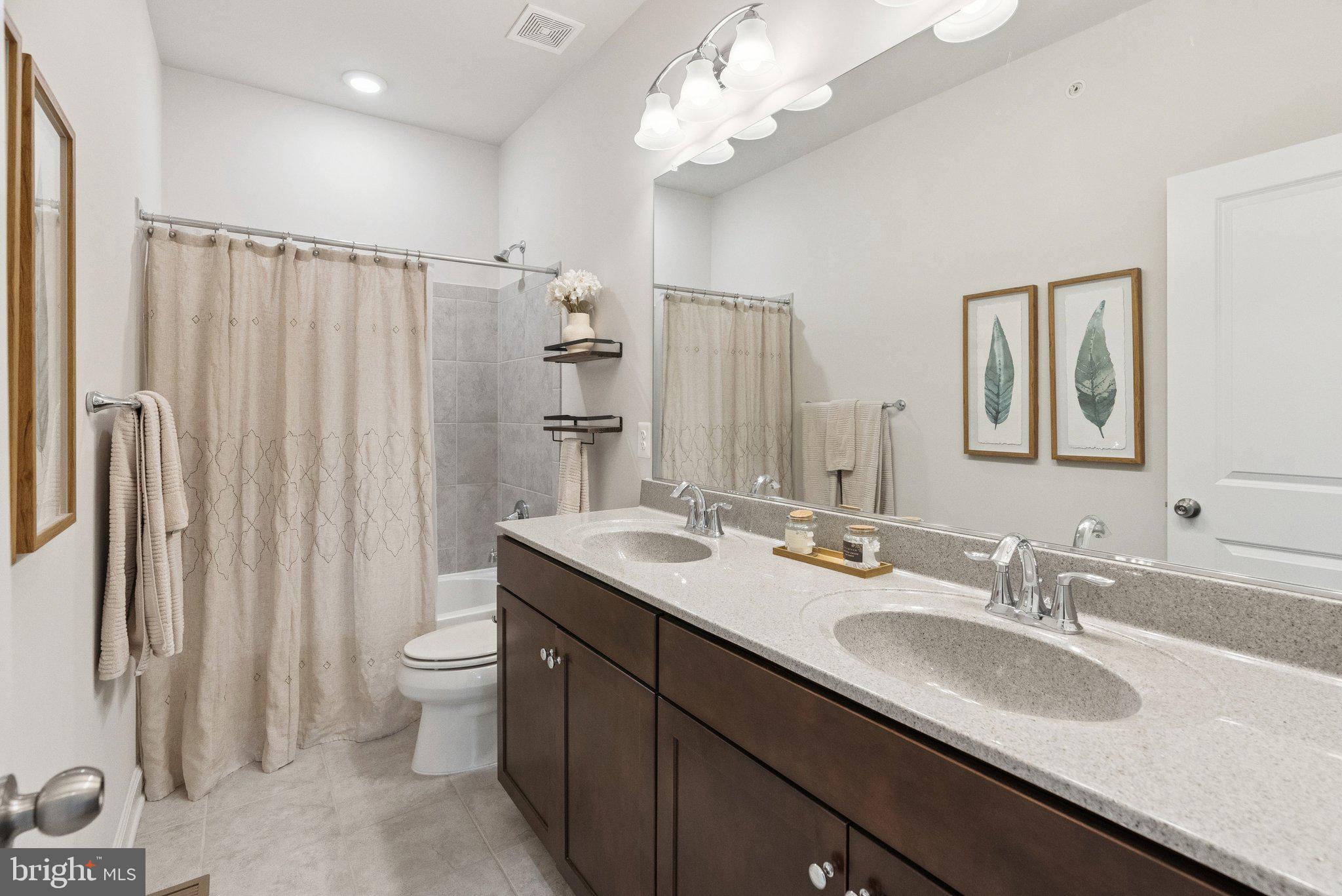 237 Barberry Lane Laytonsville, MD 20882 - Photo 42 of 70 a bathroom with double vanity sink a mirror and a shower
