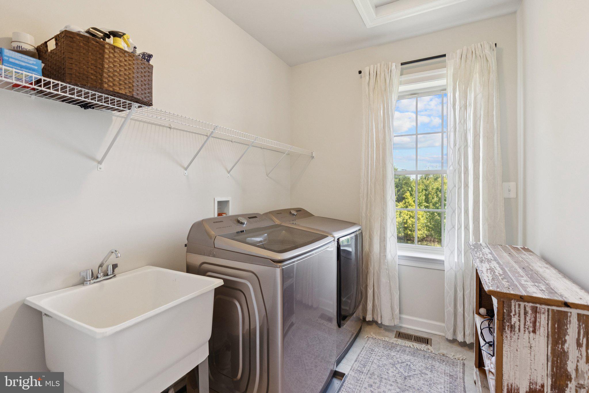 237 Barberry Lane Laytonsville, MD 20882 - Photo 45 of 70 a utility room with dryer and washer