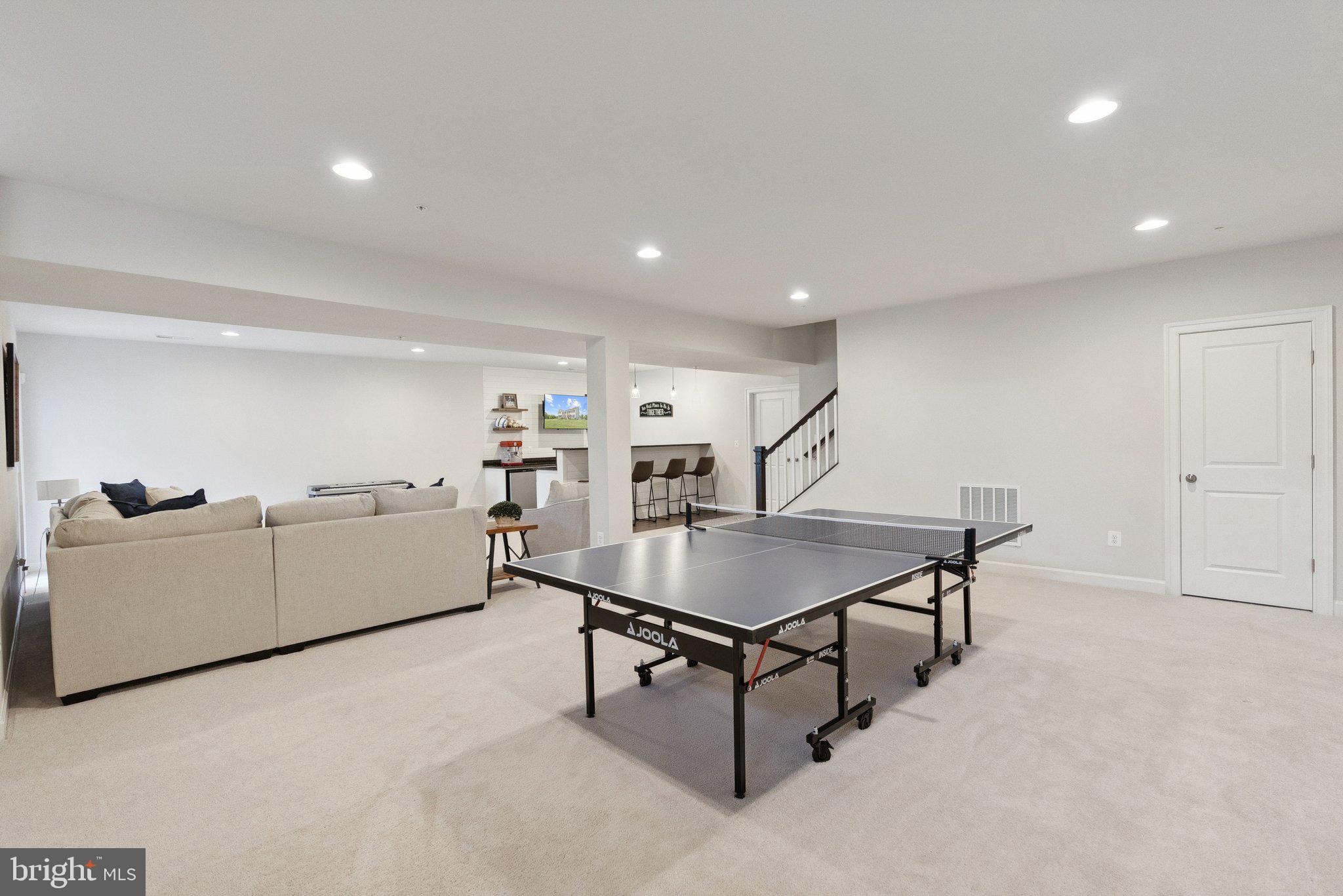 237 Barberry Lane Laytonsville, MD 20882 - Photo 49 of 70 a living room with furniture and a table