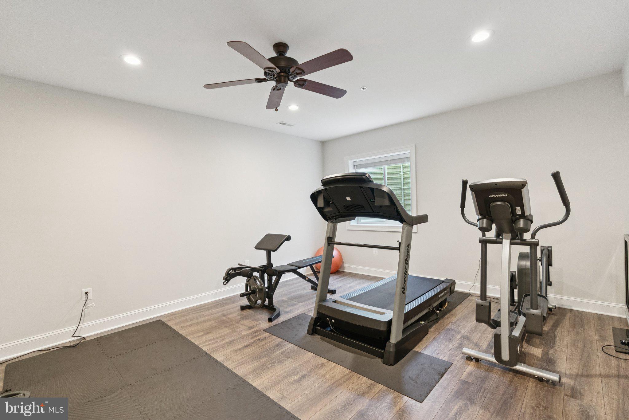 237 Barberry Lane Laytonsville, MD 20882 - Photo 50 of 70 a living room with a flat screen tv and a ceiling fan