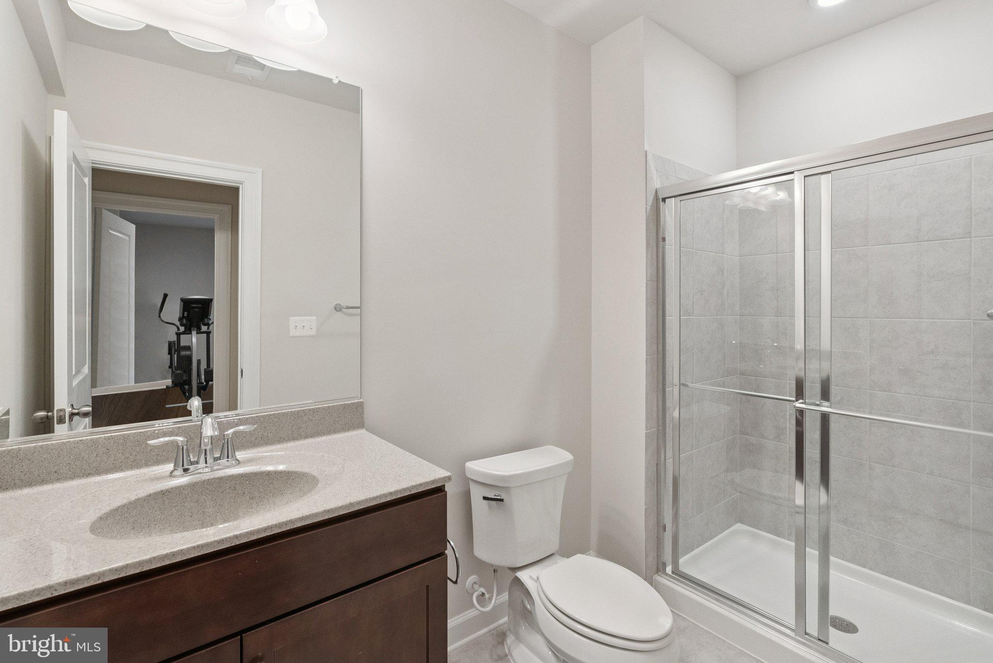 237 Barberry Lane Laytonsville, MD 20882 - Photo 51 of 70 a bathroom with a granite countertop sink toilet and shower