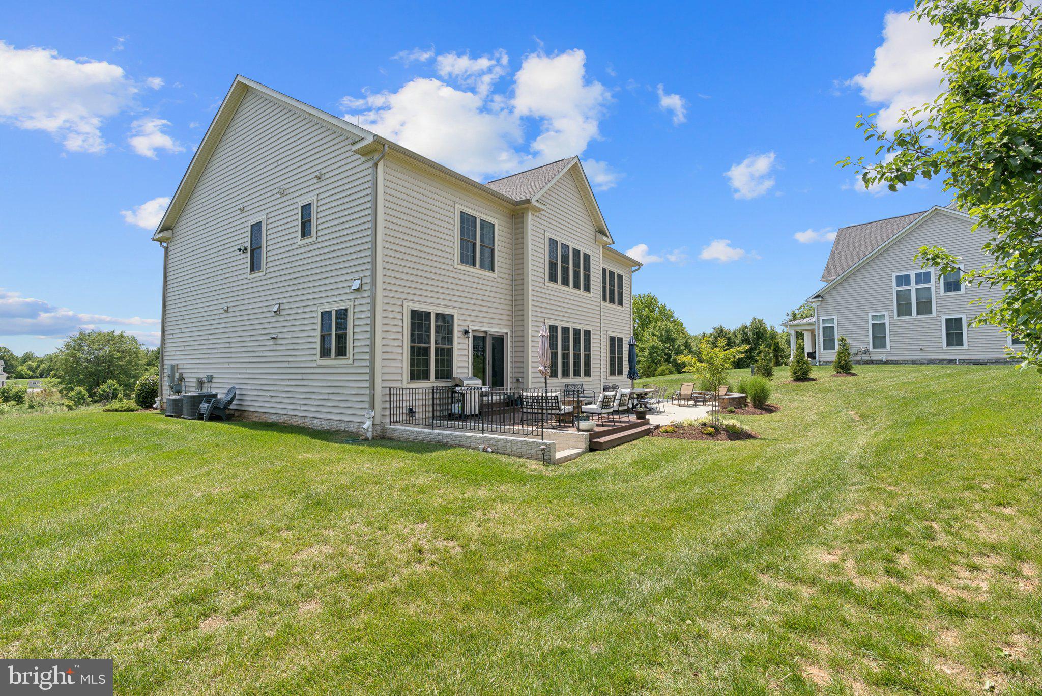 237 Barberry Lane Laytonsville, MD 20882 - Photo 58 of 70 a view of a house with backyard porch and sitting area