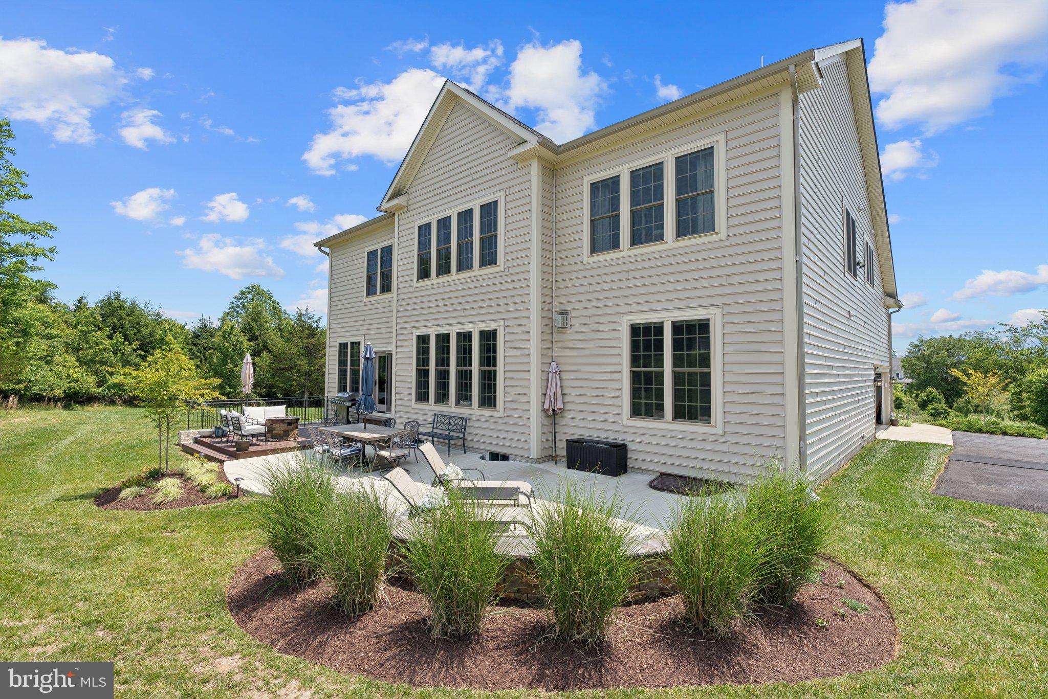 237 Barberry Lane Laytonsville, MD 20882 - Photo 59 of 70 a view of a house with backyard and sitting area