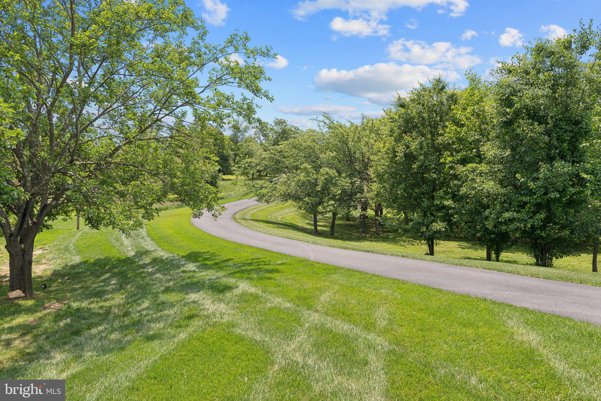 237 Barberry Lane Laytonsville, MD 20882 - Photo 67 of 70 a view of a golf course with a lake