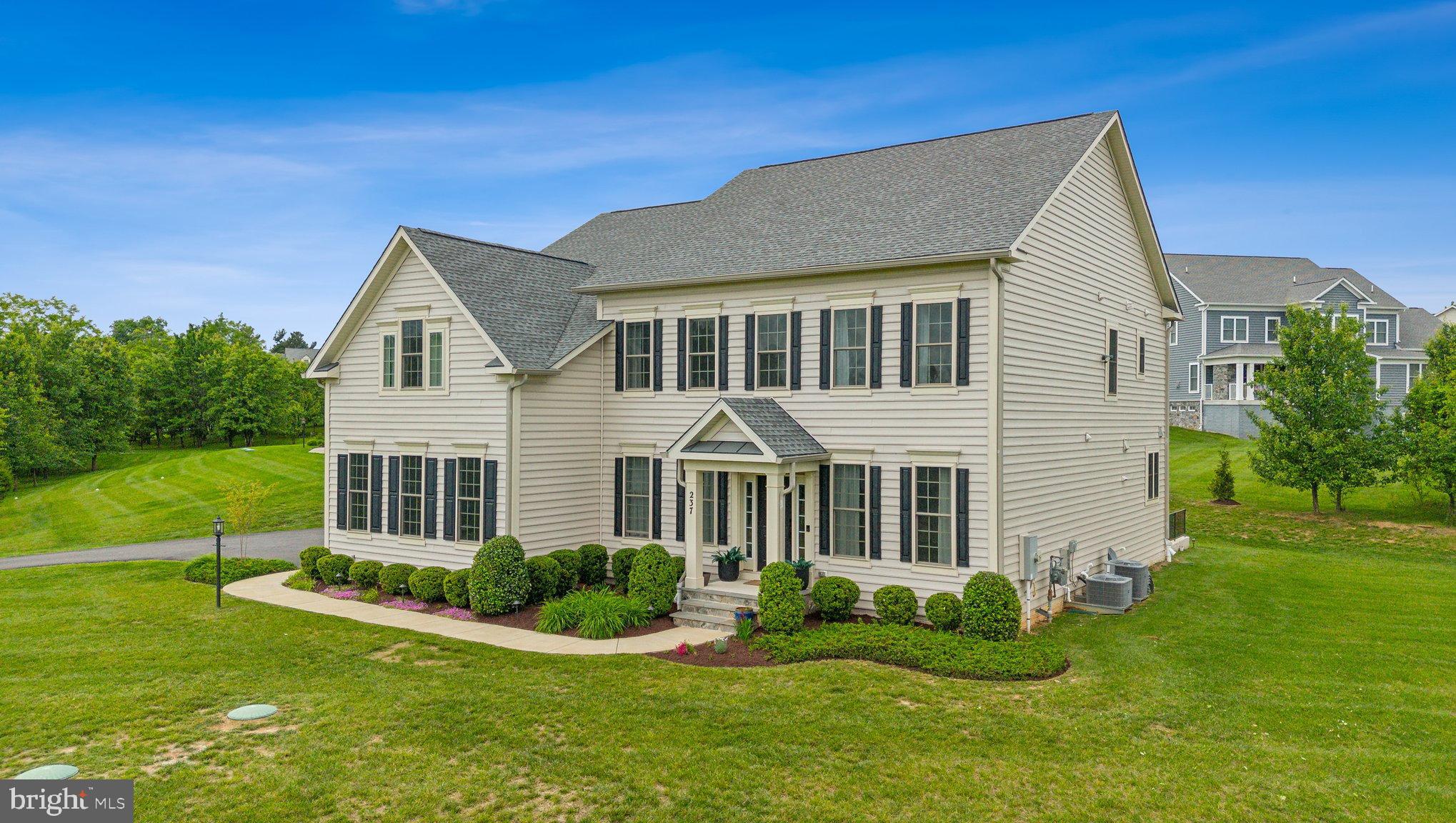 237 Barberry Lane Laytonsville, MD 20882 - Photo 68 of 70 a front view of a house with a yard
