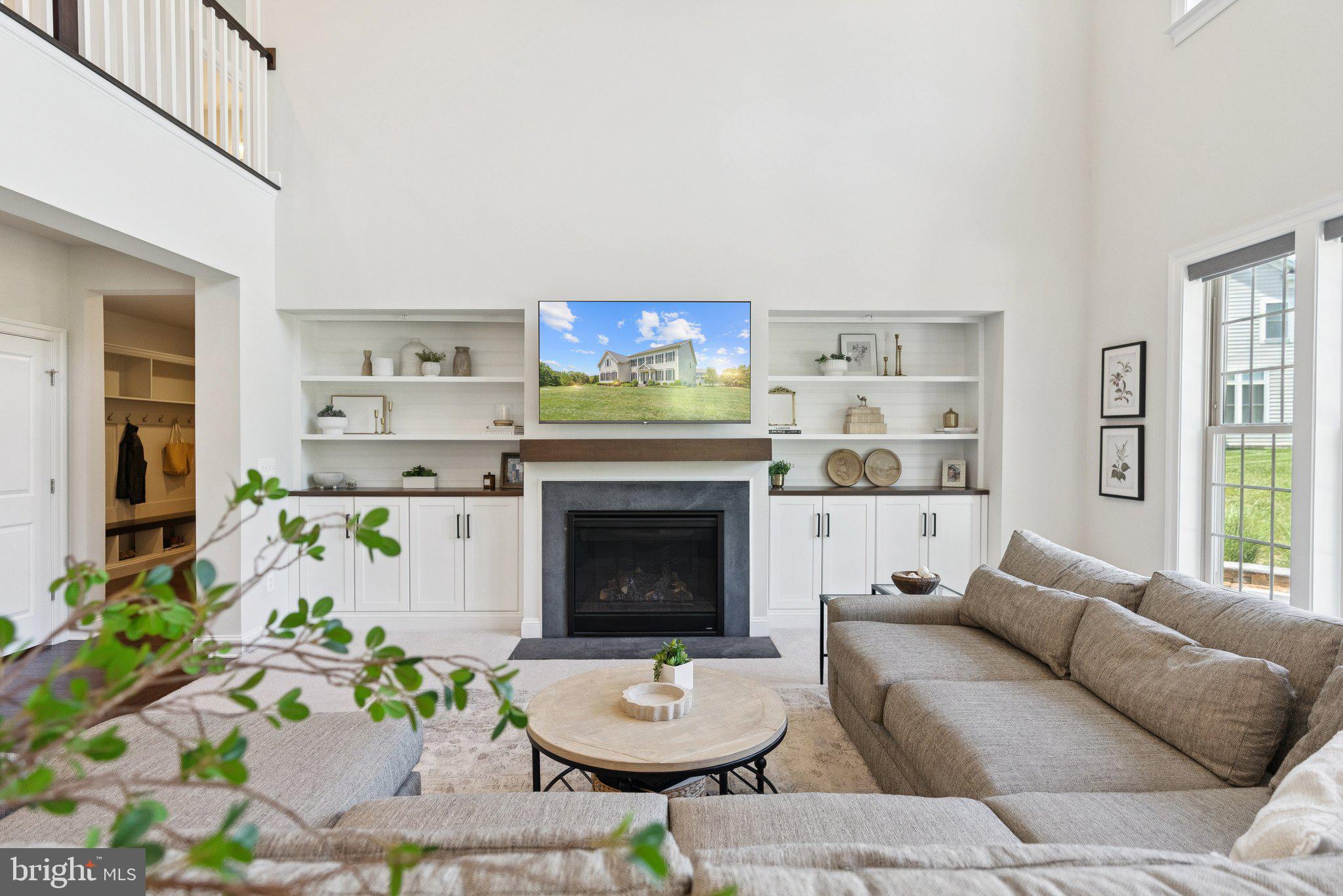 237 Barberry Lane Laytonsville, MD 20882 - Photo 8 of 70 a living room with furniture a fireplace and a flat screen tv