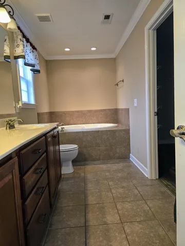 a view of a deck with couches and wooden floor