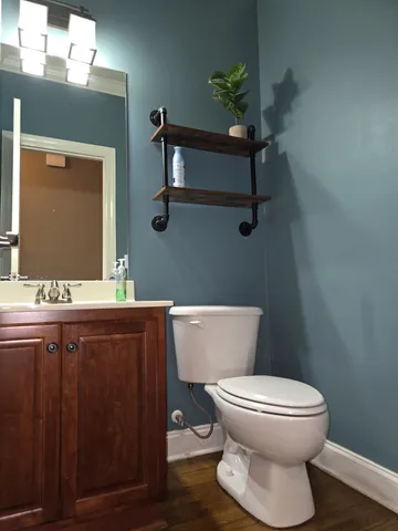 a view of a deck with wooden floor and fence