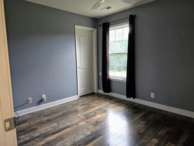 a house that has a tree in front of it