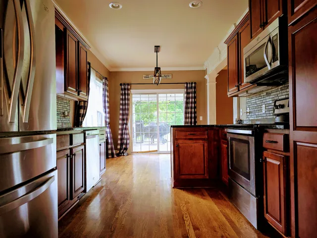 a view of a livingroom with wooden floor