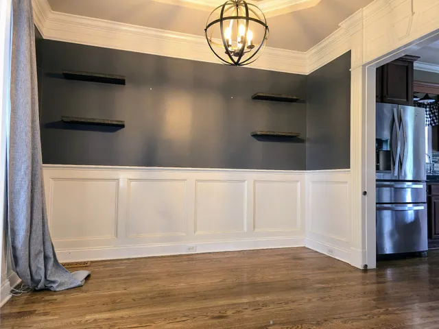 a kitchen with stainless steel appliances granite countertop a refrigerator a stove and a sink