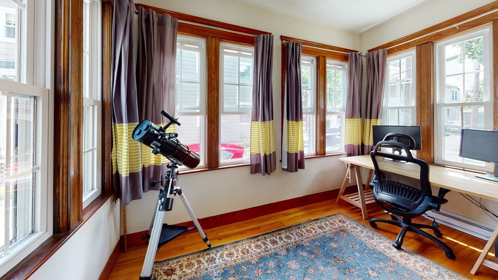 54 Chester Road, Unit 1 Belmont, MA 02478 - Photo 3 of 11 a living room with furniture and a floor to ceiling window