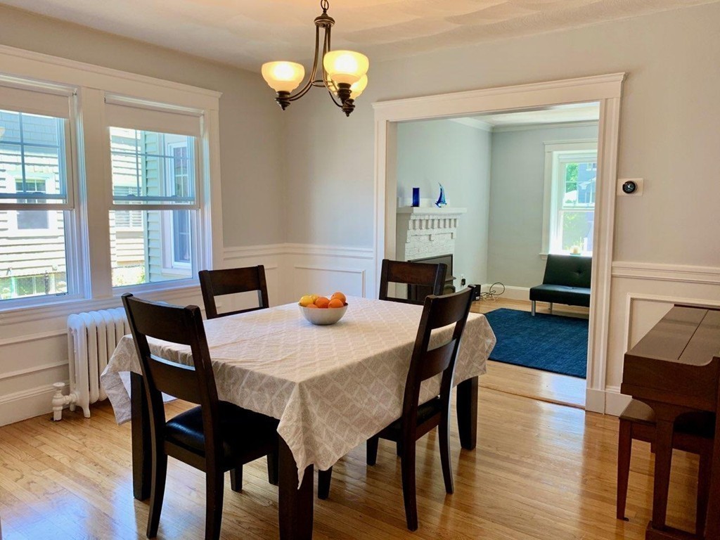 54 Chester Road, Unit 1 Belmont, MA 02478 - Photo 4 of 11 a view of a dining room with furniture window and wooden floor