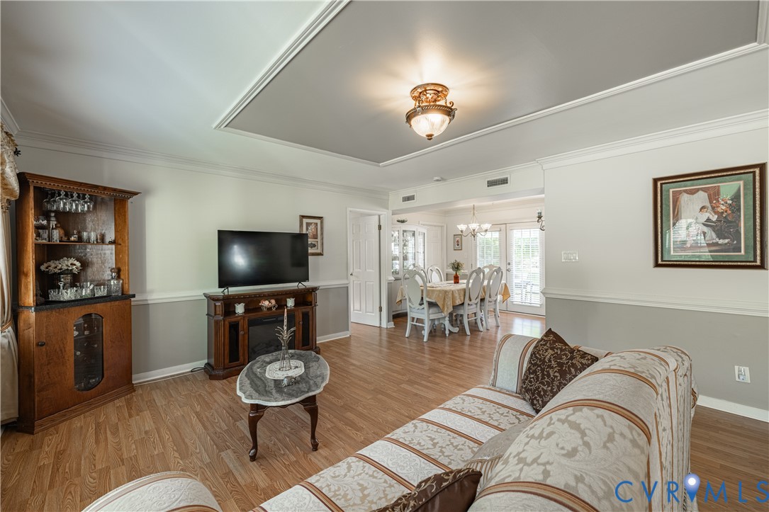 9217 Fisk Road Richmond, VA 23229 - Photo 7 of 39 a living room with furniture and a flat screen tv
