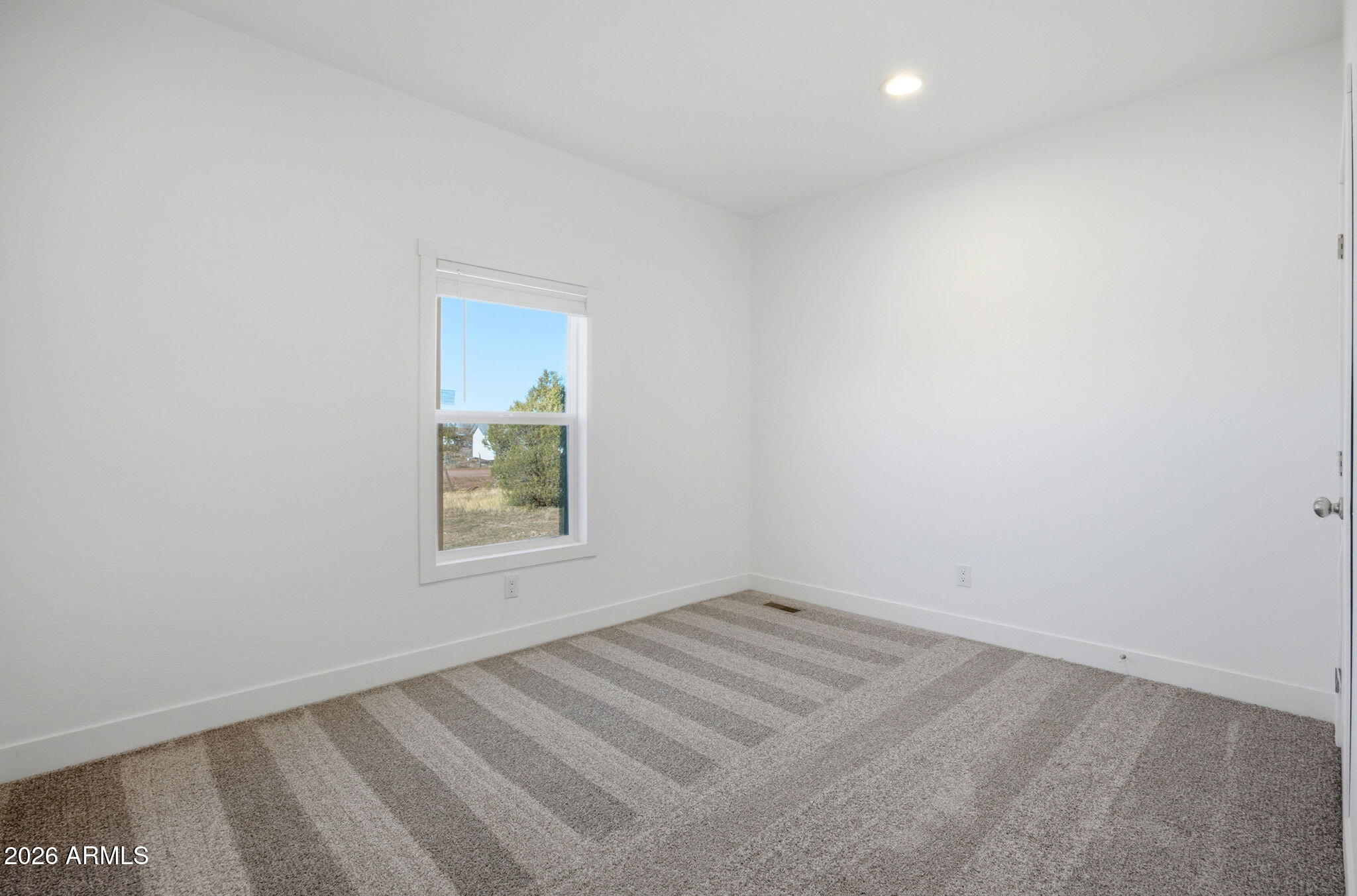 2146 Copper Road Clay Springs, AZ 85923 - Photo 16 of 30 an empty room with a window