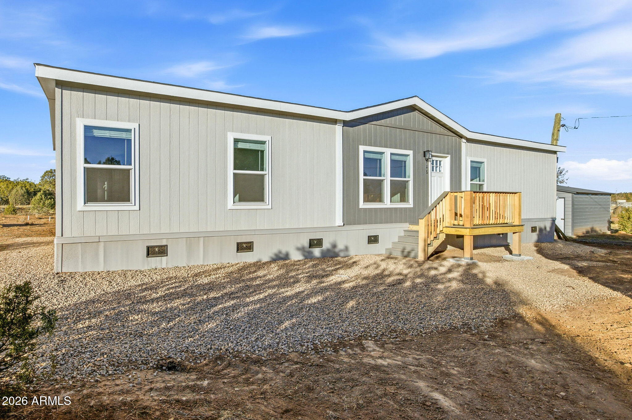 2146 Copper Road Clay Springs, AZ 85923 - Photo 2 of 30 a front view of a house with a yard