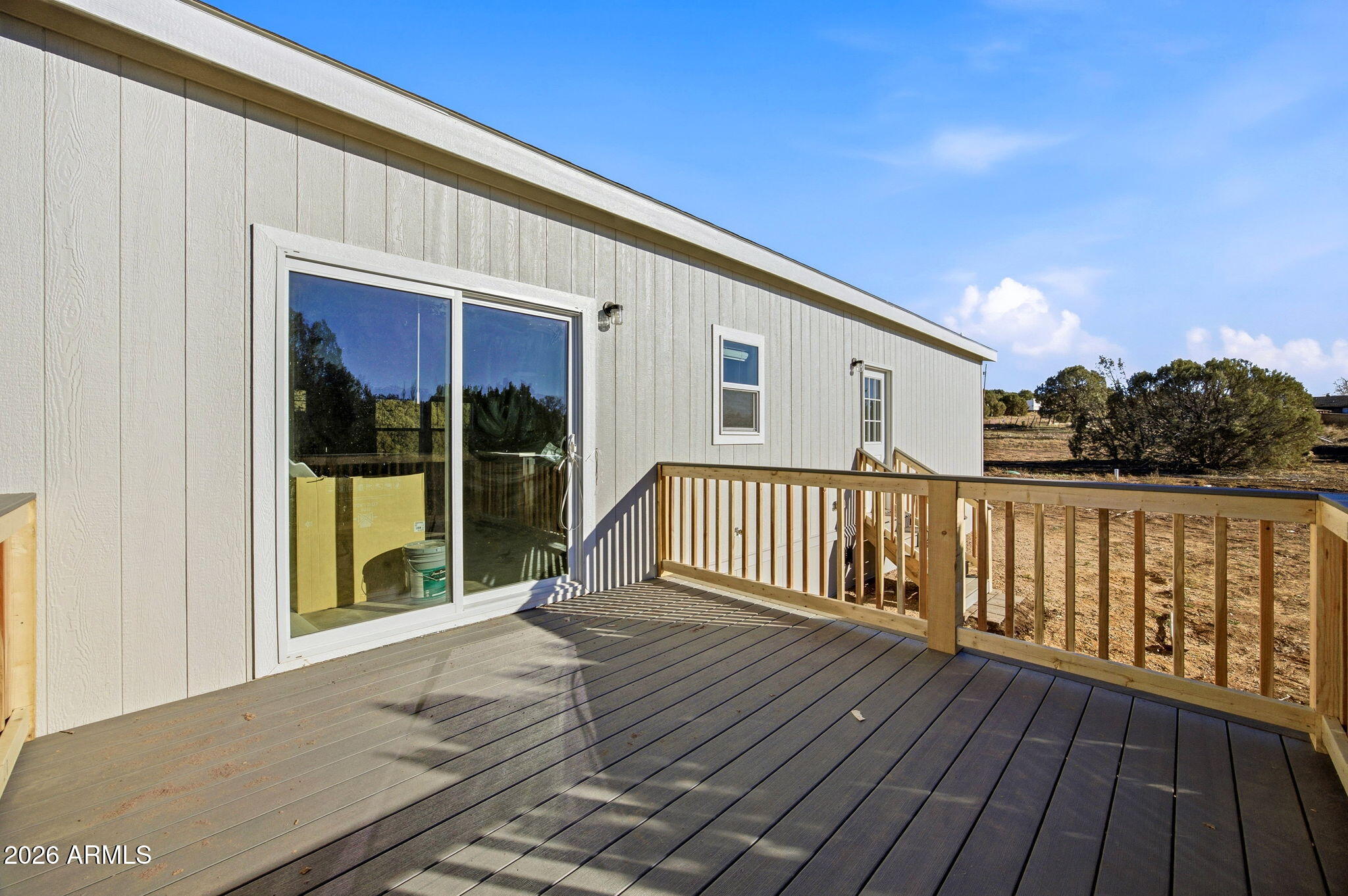 2146 Copper Road Clay Springs, AZ 85923 - Photo 22 of 30 a view of backyard with deck and outdoor seating