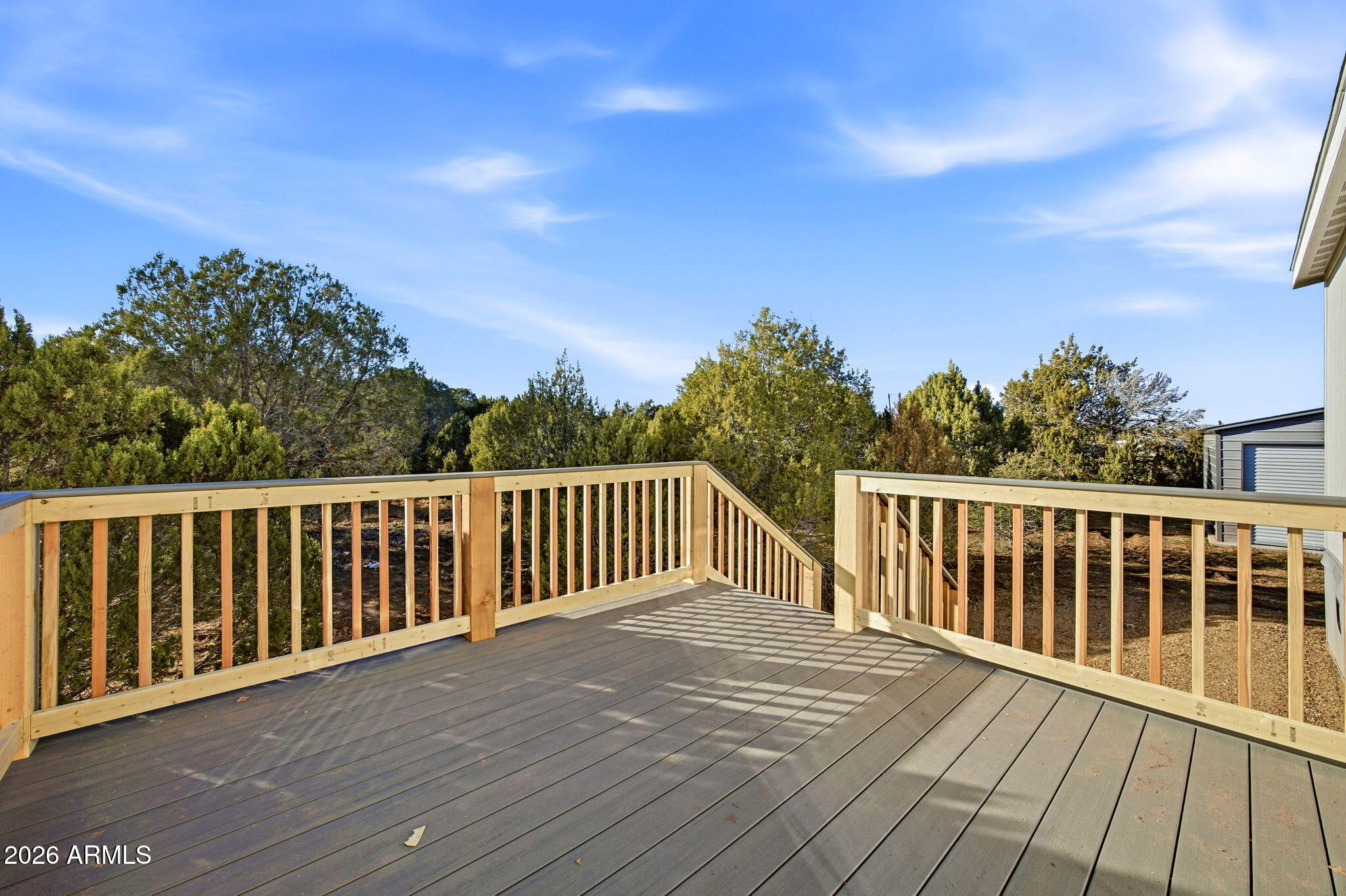 2146 Copper Road Clay Springs, AZ 85923 - Photo 23 of 30 a balcony with wooden floor and fence
