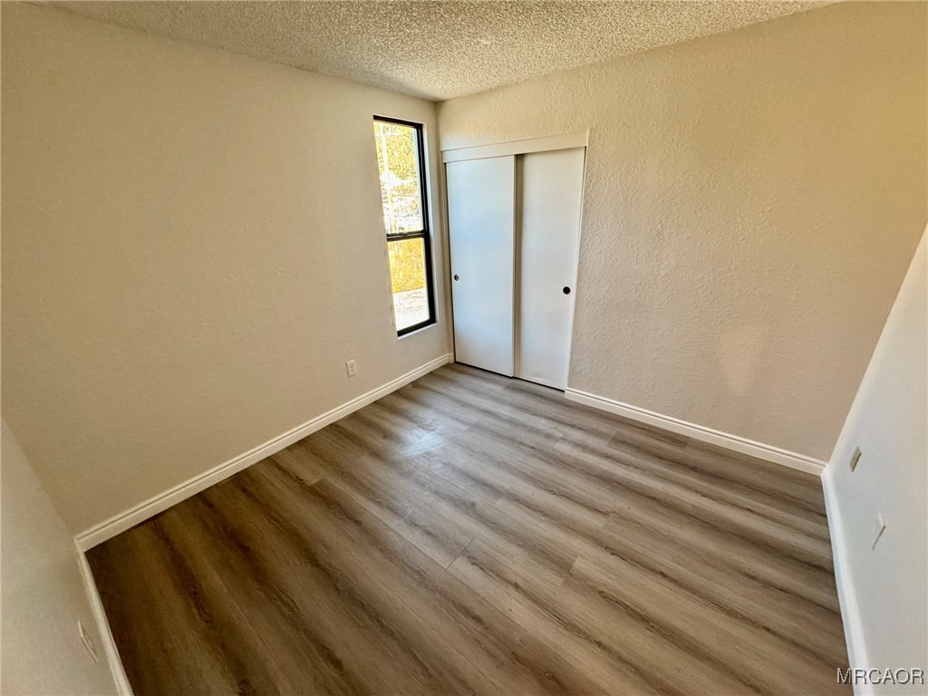 760 Blue Jay Road, Unit 44 Big Bear Lake, CA 92315 - Photo 12 of 23 a view of wooden floor and windows in a room