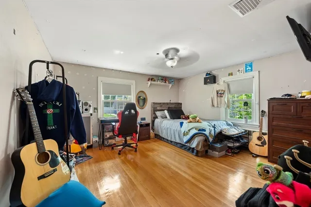 a bedroom with furniture and a gym equipment