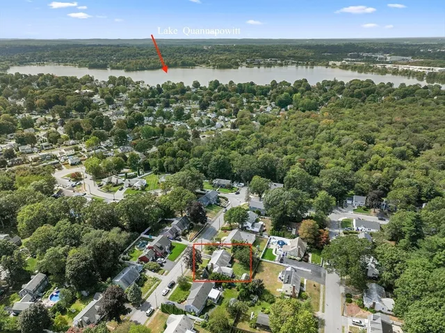 an aerial view of residential houses with outdoor and green space