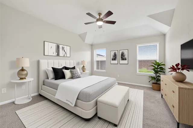 a bedroom with a large bed and a chandelier