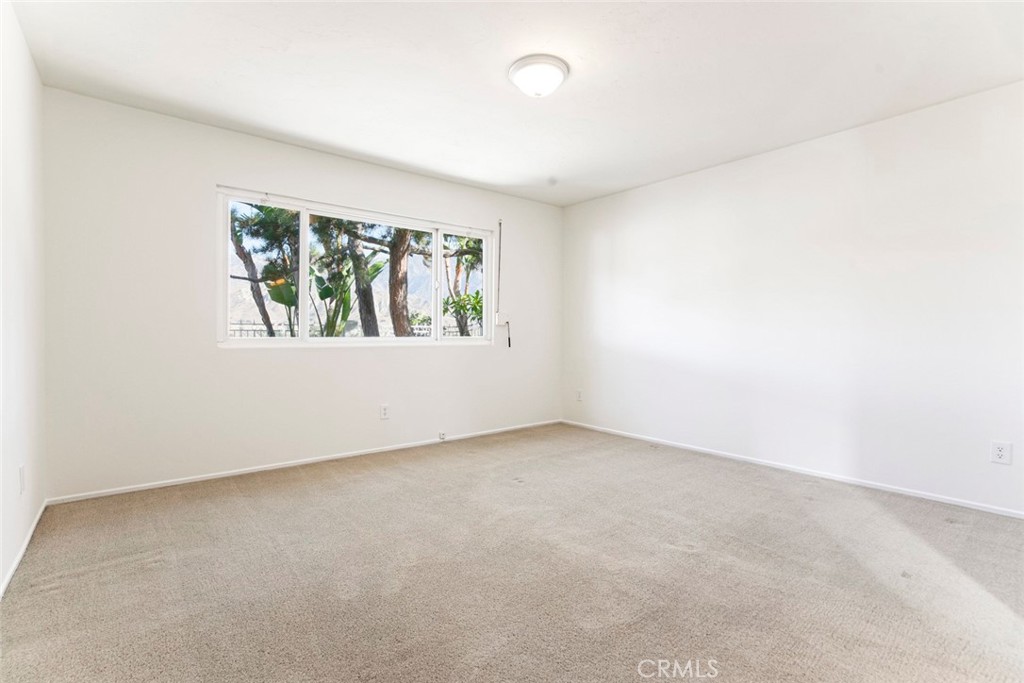 9071 Riderwood Drive Sunland, CA 91040 - Photo 14 of 46 an empty room with windows