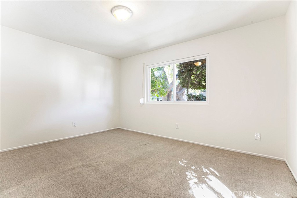 9071 Riderwood Drive Sunland, CA 91040 - Photo 19 of 46 an empty room with windows