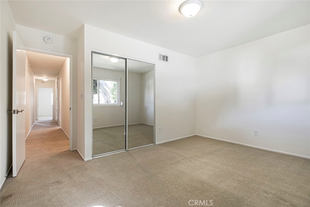 9071 Riderwood Drive Sunland, CA 91040 - Photo 20 of 46 an empty room with mirror in it