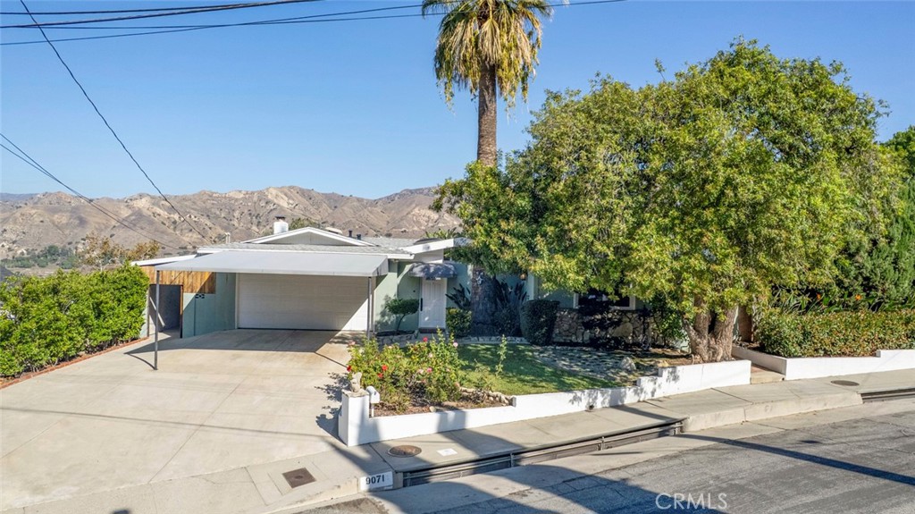 9071 Riderwood Drive Sunland, CA 91040 - Photo 2 of 46 a view of a patio with table and chairs and potted plants